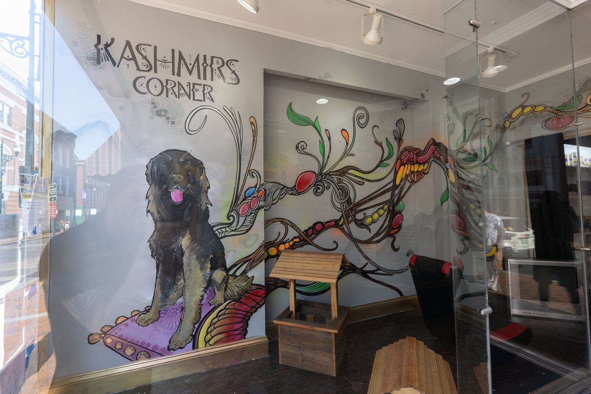 The Kashmir's Corner mural with a portrait of the shop dog
